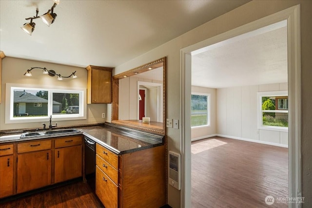 3270 Pine St, Longview, WA 98632 - kitchen featuring dark wood-type flooring, dark countertops, brown cabinets, heating unit, and black dishwasher