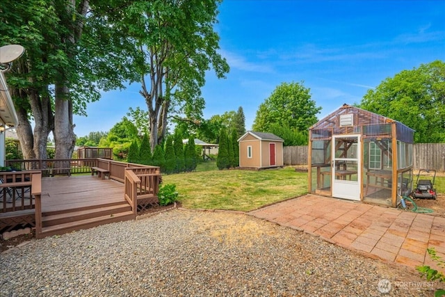 3270 Pine St, Longview, WA 98632 - fenced backyard with a shed, a wooden deck, and a greenhouse