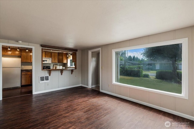 3270 Pine St, Longview, WA 98632 - unfurnished living room featuring dark wood finished floors and baseboards