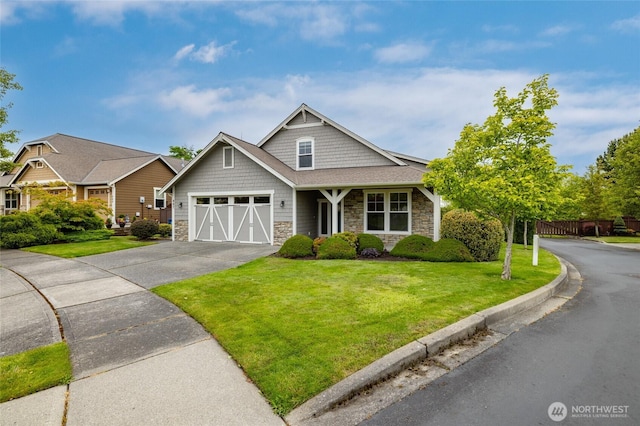 997 Chestnut Loop, Mount Vernon, WA 98273 - craftsman house featuring stone siding, driveway, and a garage