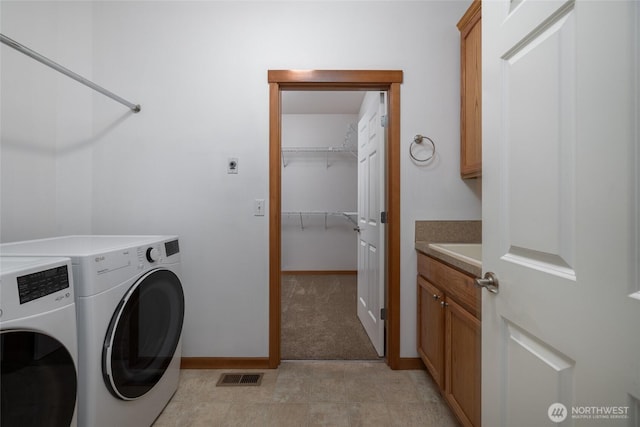 997 Chestnut Loop, Mount Vernon, WA 98273 - laundry area with washer and dryer, cabinet space, and baseboards