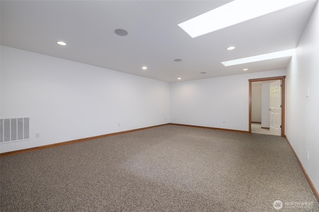 997 Chestnut Loop, Mount Vernon, WA 98273 - unfurnished room with light colored carpet, recessed lighting, baseboards, and a skylight