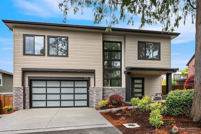 919 Cedar St, Edmonds, WA 98020 - contemporary home featuring stone siding, a garage, and driveway