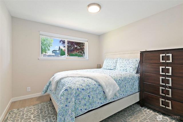 3415 Garden Ave N, Renton, WA 98056 - bedroom featuring baseboards and wood finished floors
