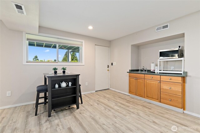 3415 Garden Ave N, Renton, WA 98056 - dining area featuring light wood finished floors, baseboards, and recessed lighting