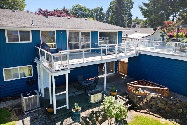 3415 Garden Ave N, Renton, WA 98056 - rear view of property featuring ac unit, a patio, and a shingled roof