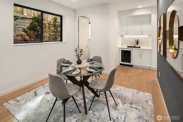290 118th Ave SE, Bellevue, WA 98005 - dining space with wine cooler, wet bar, light wood-type flooring, baseboards, and recessed lighting