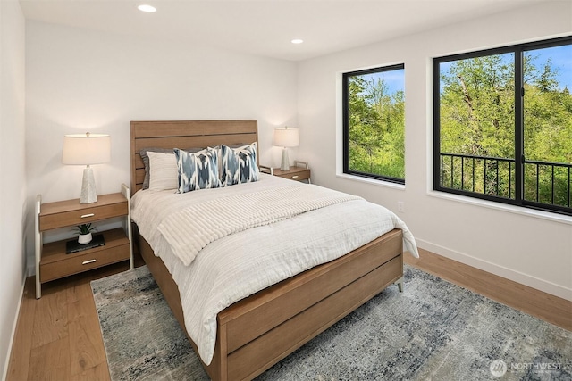 290 118th Ave SE, Bellevue, WA 98005 - bedroom featuring wood finished floors, baseboards, and recessed lighting