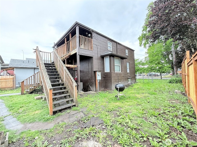 328 S Division St, Auburn, WA 98001 - rear view of house with stairway and a wooden deck