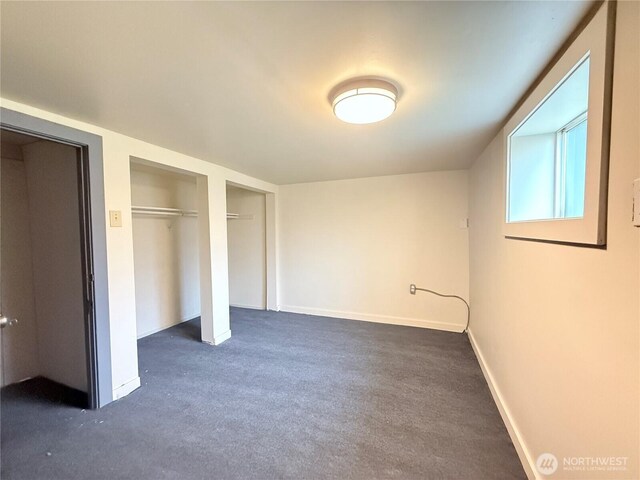 328 S Division St, Auburn, WA 98001 - unfurnished bedroom with dark carpet and baseboards