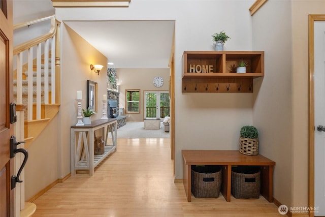 mudroom with light wood-type flooring and baseboards