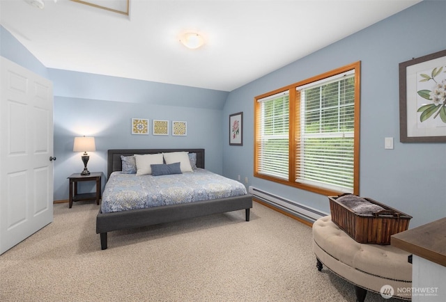 bedroom with a baseboard radiator, carpet flooring, vaulted ceiling, and baseboards