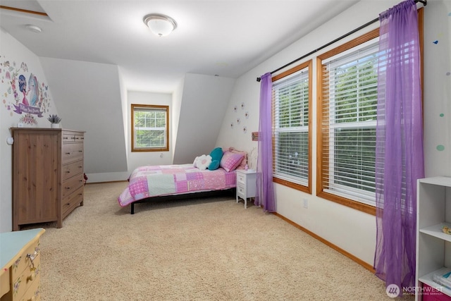 carpeted bedroom featuring baseboards