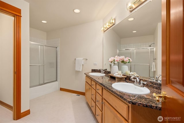 6715 NE Dapple Ct, Bainbridge Island, WA 98110 - full bathroom with double vanity, recessed lighting, baseboards, and combined bath / shower with glass door
