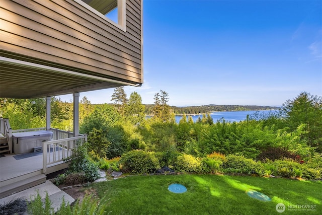 6715 NE Dapple Ct, Bainbridge Island, WA 98110 - view of green lawn with a deck with water view