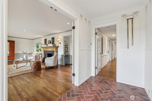 16255 38th Ave NE, Lake Forest Park, WA 98155 - corridor featuring a decorative wall, ornamental molding, wainscoting, and brick flooring
