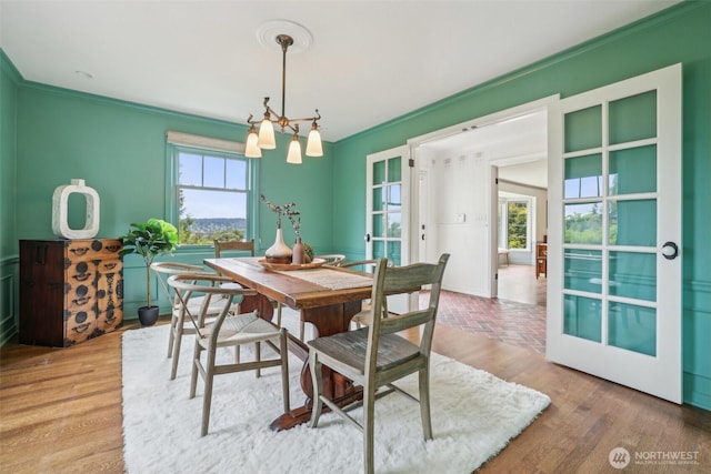 16255 38th Ave NE, Lake Forest Park, WA 98155 - dining room featuring ornamental molding, french doors, a chandelier, and wood finished floors