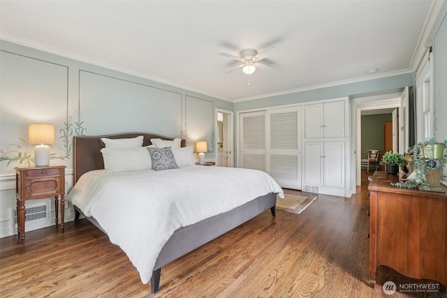 16255 38th Ave NE, Lake Forest Park, WA 98155 - bedroom with a closet, a decorative wall, wood finished floors, ornamental molding, and ceiling fan