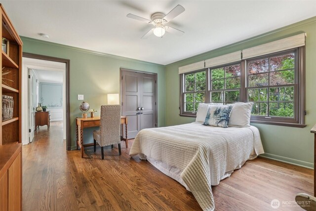 16255 38th Ave NE, Lake Forest Park, WA 98155 - bedroom featuring wood finished floors, baseboards, crown molding, and a ceiling fan