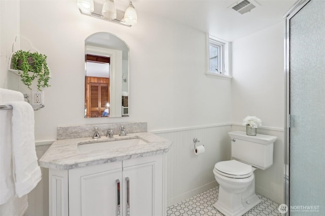 16255 38th Ave NE, Lake Forest Park, WA 98155 - full bathroom with toilet, wainscoting, vanity, and a shower with shower door