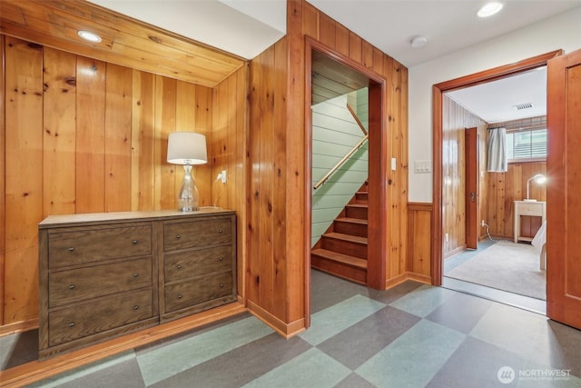 16255 38th Ave NE, Lake Forest Park, WA 98155 - hallway featuring tile patterned floors, wooden walls, baseboards, stairs, and recessed lighting