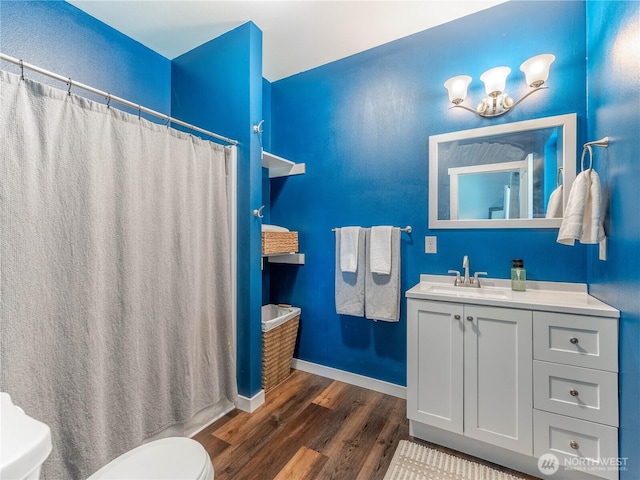 202 Chipmunk Trail Rd, East Wenatchee, WA 98802 - bathroom with toilet, wood finished floors, vanity, baseboards, and a shower with curtain