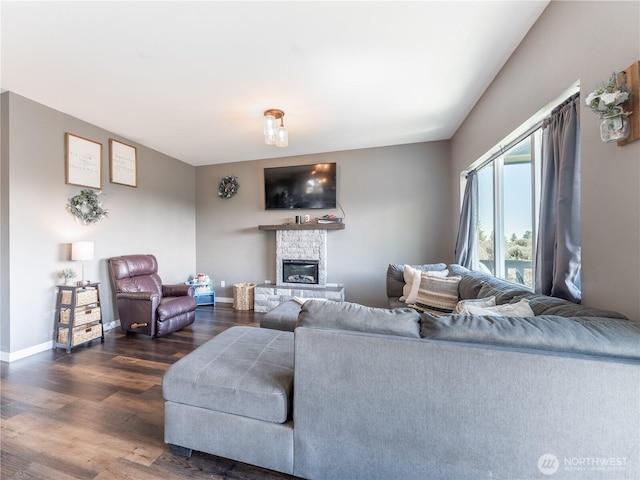 202 Chipmunk Trail Rd, East Wenatchee, WA 98802 - living area with wood finished floors, a stone fireplace, and baseboards