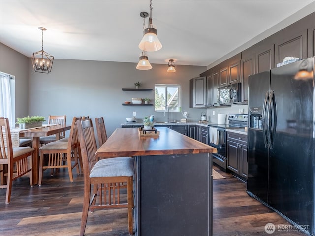 202 Chipmunk Trail Rd, East Wenatchee, WA 98802 - kitchen featuring black appliances, wood counters, a kitchen island, dark wood-style flooring, and decorative light fixtures