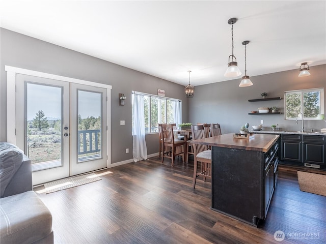 202 Chipmunk Trail Rd, East Wenatchee, WA 98802 - kitchen featuring wood counters, a kitchen bar, french doors, dark wood-type flooring, and a sink