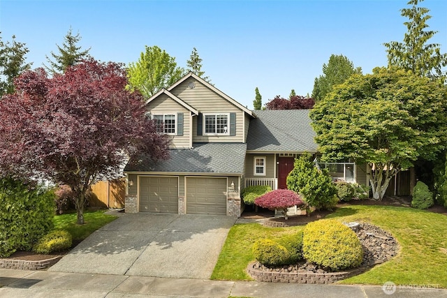 7725 Perregrine Pl, Arlington, WA 98223 - view of front facade featuring concrete driveway, an attached garage, brick siding, and roof with shingles