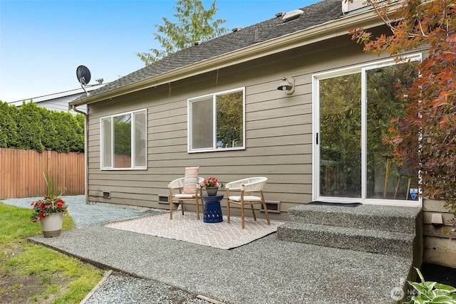 7725 Perregrine Pl, Arlington, WA 98223 - rear view of property featuring entry steps, a patio, fence, and roof with shingles