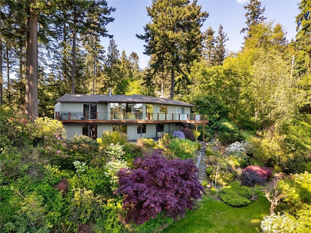15127 Gibralter Rd, Anacortes, WA 98221 - back of property featuring a deck and a wooded view