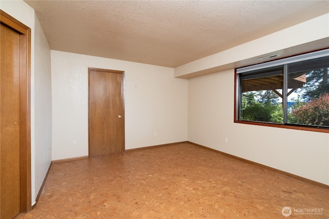15127 Gibralter Rd, Anacortes, WA 98221 - unfurnished room featuring a textured ceiling and baseboards