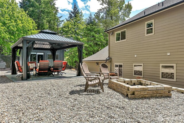 view of patio / terrace with a gazebo and an outdoor living space