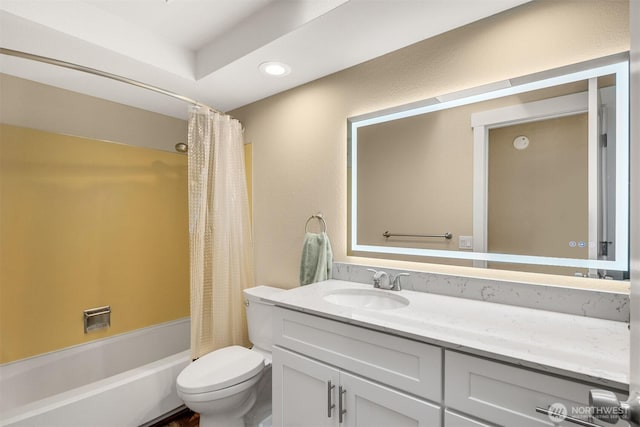 bathroom with vanity, toilet, shower / bath combo, and recessed lighting