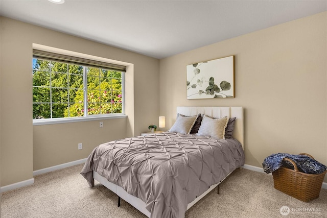 bedroom featuring carpet floors and baseboards