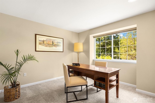 carpeted office featuring baseboards