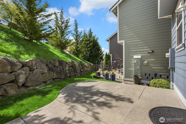 view of side of home featuring a patio area