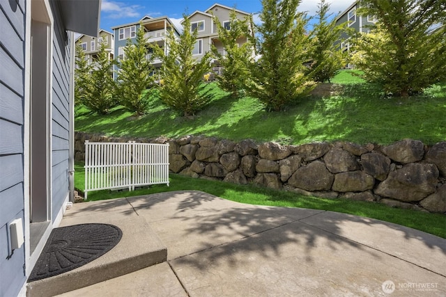 view of patio featuring fence