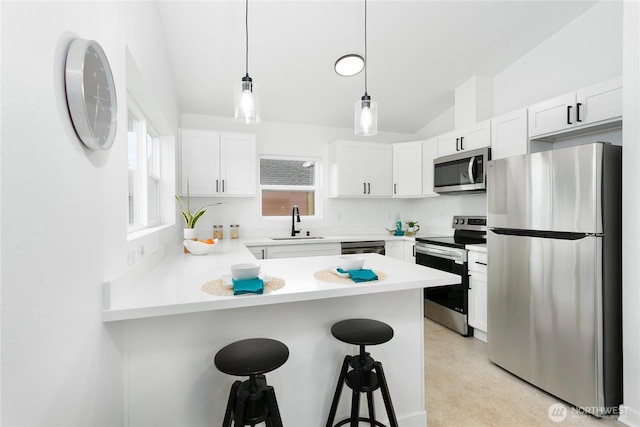 2805 S 11th St, Tacoma, WA 98405 - kitchen with appliances with stainless steel finishes, a sink, lofted ceiling, a peninsula, and white cabinets