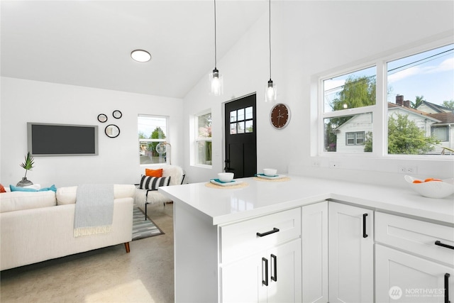 2805 S 11th St, Tacoma, WA 98405 - kitchen featuring open floor plan, light countertops, a peninsula, white cabinetry, and high vaulted ceiling