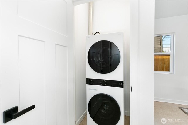 2805 S 11th St, Tacoma, WA 98405 - laundry room featuring estacked washer and dryer and baseboards