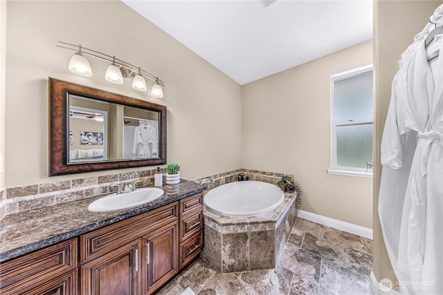 7911 Oregon Trl, Maple Falls, WA 98266 - bathroom featuring vanity, a bath, and baseboards