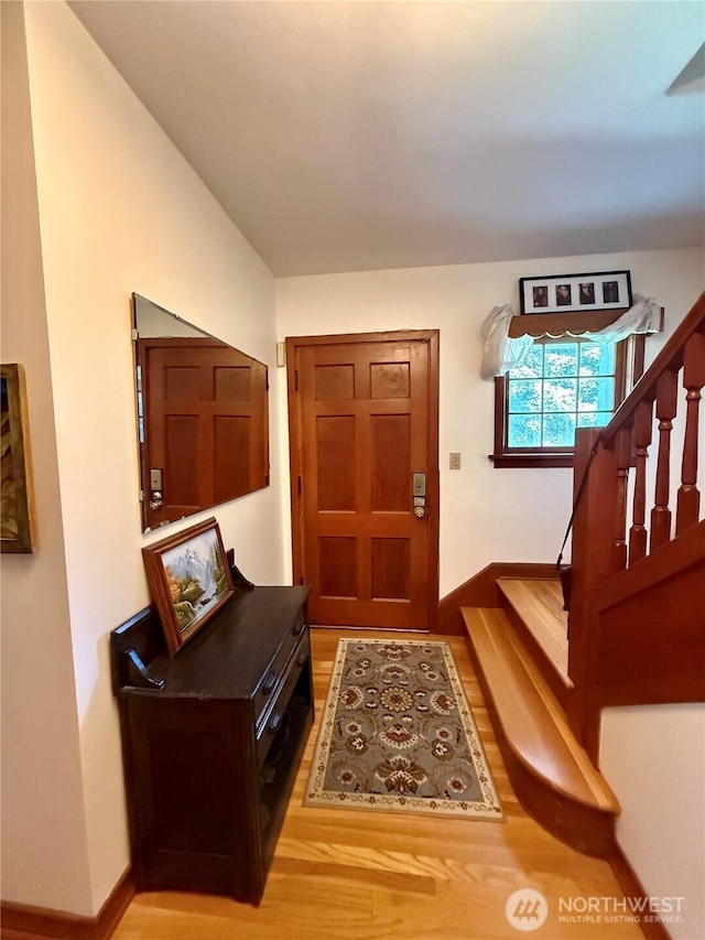 720 E Tremont St, Dayton, WA 99328 - entryway featuring stairway, baseboards, and light wood finished floors