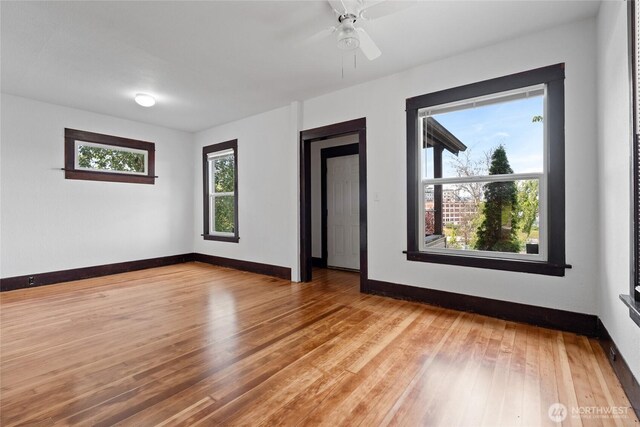 310 S 28th St, Tacoma, WA 98402 - spare room with light wood finished floors, baseboards, and ceiling fan