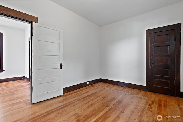 310 S 28th St, Tacoma, WA 98402 - empty room featuring baseboards and light wood-style floors