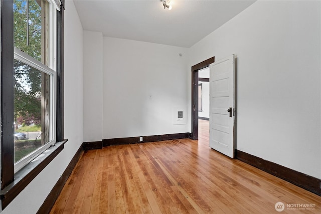 310 S 28th St, Tacoma, WA 98402 - unfurnished room with baseboards and hardwood / wood-style floors