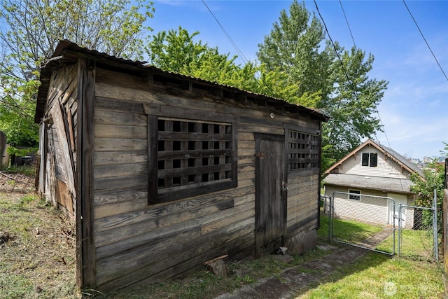 310 S 28th St, Tacoma, WA 98402 - view of outbuilding featuring fence, a gate, and an outbuilding