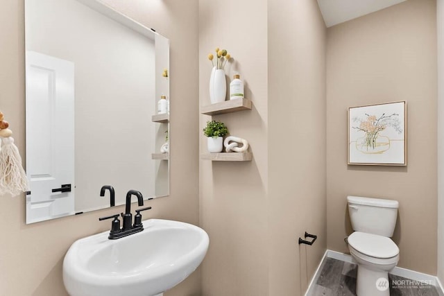14707 87th Ave SE Unit Ff5, Snohomish, WA 98296 - half bath featuring a sink, toilet, baseboards, and wood finished floors