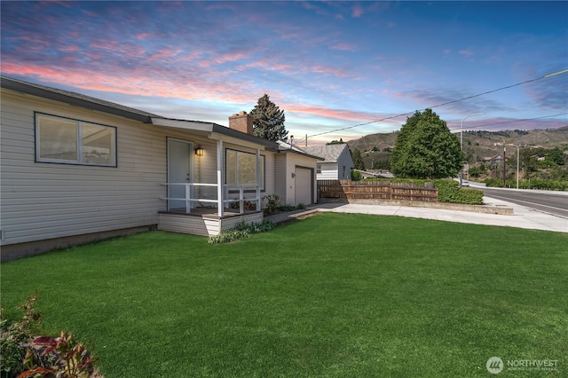 1819 Springwater Ave, Wenatchee, WA 98801 - yard at dusk featuring driveway and a garage